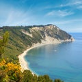 Summer Adriatic sea bay and blossoming Spiaggia Mezzavalle beach near Portonovo and Ancona towns in the Marche region. Italy, Royalty Free Stock Photo