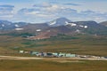 Summer aerial view of the air town and the runway of the arctic airfield.
