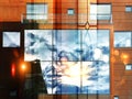 Summer afternoon evening in city modern houses reflection in windows glass at summer  sun beam flare, urban lifestile scene Royalty Free Stock Photo