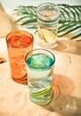 Summer alcoholic cocktails in colorful glasses on beach with white sand. Summer sea ocean vacation and travel concept Royalty Free Stock Photo