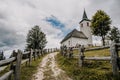 Summer alpine countryside landscape with high mountains and farms in the forest glade. Logar valley Logarska Dolina from the pan Royalty Free Stock Photo