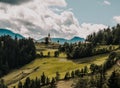 Summer alpine countryside landscape with high mountains and farms in the forest glade. Logar valley Logarska Dolina from the pan