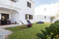 Summer apartment garden with chairs and pillows setup