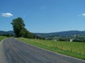 Summer asphalt road over a hill