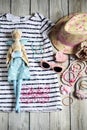 Summer attributes, Swedes and hat for little girl and doll in th Royalty Free Stock Photo