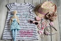 Summer attributes, Swedes and hat for little girl and doll in th Royalty Free Stock Photo