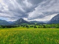 Summer austrian landscape with green meadows and impressive mountains, view from small alpine village Tauplitz, Styria region, Royalty Free Stock Photo