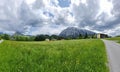 Summer austrian landscape with Grimming mountain 2.351 m, an isolated peak in the Dachstein Mountains, view from small alpine Royalty Free Stock Photo