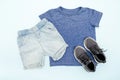 Summer babies blue clothes and accessories with t shirt, shorts,sneakers. Modern fashion kids casual outfit.Set of Royalty Free Stock Photo