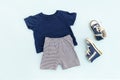 Summer babies blue clothes and accessories with t shirt, shorts,sneakers. Modern fashion kids outfit.Set of children Royalty Free Stock Photo