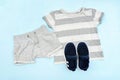 Summer babies gray clothes and accessories with t shirt, shorts,sneakers. Modern fashion kids casual outfit.Set of Royalty Free Stock Photo