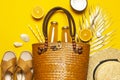 Summer background Beach accessories. Beach wicker straw rattan women`s eco bag sandals hat golden tropical leaf coconut Royalty Free Stock Photo