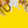 Summer background Beach accessories. Beach wicker straw or rattan women`s eco bag white dress straw hat sandals golden tropical Royalty Free Stock Photo
