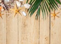 Summer background with beach sand, starfishs coconut leaves and shells decoration hanging on blue wooden background Royalty Free Stock Photo