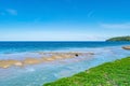 Summer background of Beautiful sandy beach Wave crashing on sandy shore Landscape nature view Romantic ocean bay with blue water Royalty Free Stock Photo