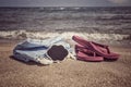 Summer background with flip flops and towel on beach Royalty Free Stock Photo