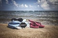 Summer background with flipflops and sunglasses on beach Royalty Free Stock Photo