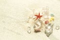 Summer background with seashells, starfish and ice on the sand, space for text Royalty Free Stock Photo