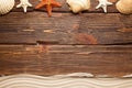 Summer background - shell, starfish and beach sand on wooden tab Royalty Free Stock Photo