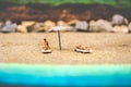 Summer background sunbather couple in deserted beach sunbathing with copy space