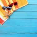 Summer background sunglasses, sunbathing. beach scene blue wood background