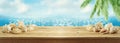 Summer background with wooden table, seashells nad palm tree over sea bokeh Royalty Free Stock Photo