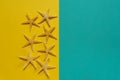 Summer background of yellow and blue paper with starfish, symbol Royalty Free Stock Photo