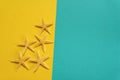 Summer background of yellow and blue paper with starfish, symbol Royalty Free Stock Photo