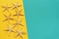 Summer background of yellow and blue paper with starfish, symbol Royalty Free Stock Photo