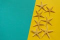 Summer background of yellow and blue paper with starfish, symbol Royalty Free Stock Photo