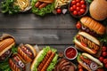 Summer BBQ food table scene with a dark wood background showing a top view of hot dogs and hamburgers buffet Royalty Free Stock Photo