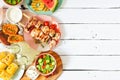 Summer BBQ or picnic food side border, above view over a white wood background Royalty Free Stock Photo