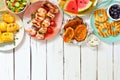 Summer BBQ or picnic food top border, above view over a white wood background Royalty Free Stock Photo