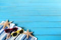 Summer beach background border, sunglasses, starfish, blue wood copy space Royalty Free Stock Photo