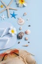 Summer Beach Background Design Concept With Shells, Hat, Slipper On Blue Background