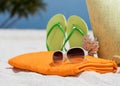 Summer beach bag with coral,towel,sunglasses and flip flops Royalty Free Stock Photo