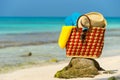 Summer beach bag with shell, towel on beach Royalty Free Stock Photo