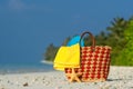 Summer beach bag with shell, towel on sandy beach Royalty Free Stock Photo