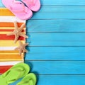 Summer beach border, sunglasses, flip flops, blue wood copy space square Royalty Free Stock Photo