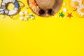 Summer Beach Design Concept With Shells, Hat, Slipper On Yellow Background