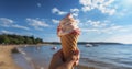 A Summer Beach Experience - Hand hold Melting ice cream cone at beautiful beach in summer with blue sky. Generative AI Royalty Free Stock Photo