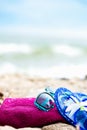 Summer Beach Holiday. Fuschia Towel, Sunglasses, Jelly Sandals l Royalty Free Stock Photo