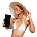 Summer beach holiday a woman showing screen of mobile phone she's wearing a bikini and sun hat, isolated on a white Royalty Free Stock Photo