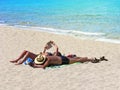 Summer, beach holidays, couple, sunbathe, sea Royalty Free Stock Photo