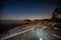 Summer Beach illuminated at night at Deception Pass Royalty Free Stock Photo