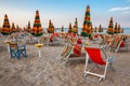 Summer beach landscape with umbrellas and beach chairs