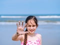 Summer beach - Little girl have a good time of resort beach. Kid playing on sandy beach. Focus on the hand Royalty Free Stock Photo