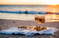 summer beach picnic at sunset. champagne in the glasses on sandy beach Royalty Free Stock Photo