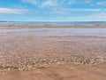 summer beach sand sea water wave sunny day blue sky white clouds at Baltic sea seascape