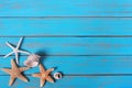 Summer beach seashore background starfish blue old wood paint peeeling